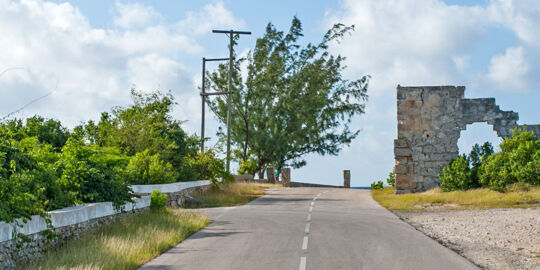 Road and ruins of old limestone salt warehouse on South Caicos