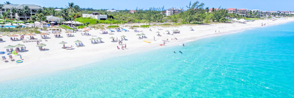 Beach chairs and umbrellas at Grace Bay Beach in Turks and Caicos