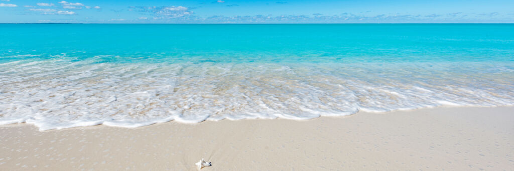 Turquoise water and wave on the beach at Leeward on Providenciales