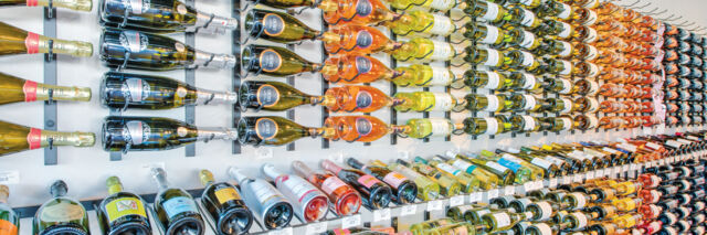 Vertical wine display at a liquor store.