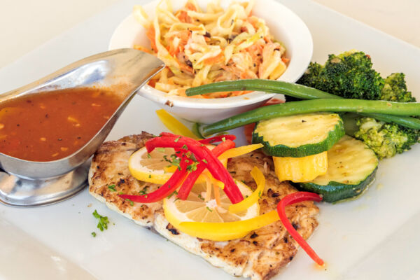 Creole-style local snapper with vegetables and coleslaw