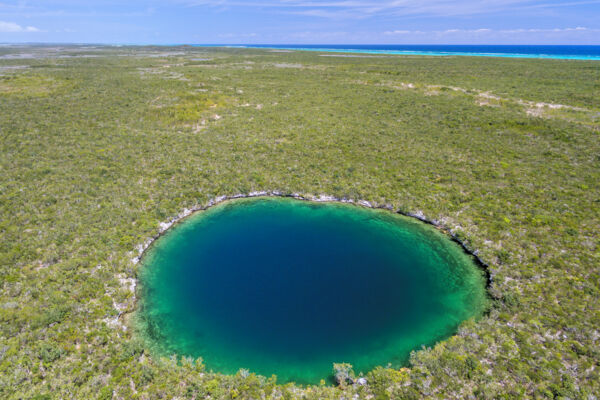 Aerial view of a blue hole on East Caicos