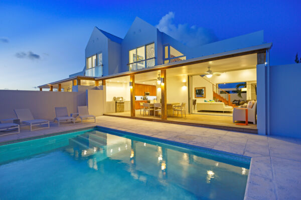 The pool at Edge of Paradise villa at dusk