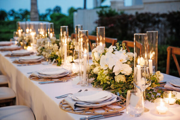 Table decor at a resort wedding in Turks and Caicos, dusk. 