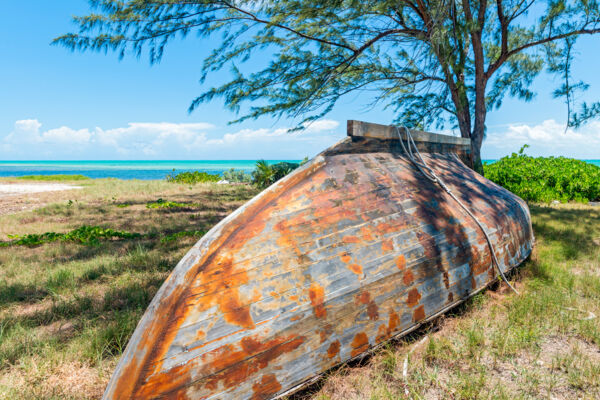 Caicos Sloop hull on the shore of Blue Hills on Providenciales