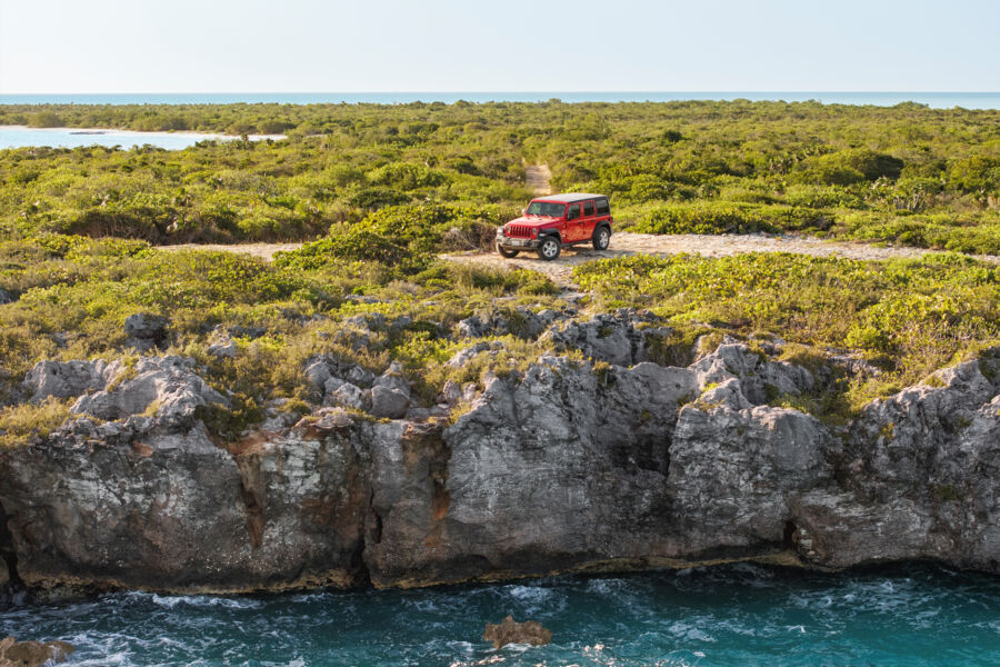 Jeep parked in the Frenchman's Creek and Pigeon Pond Nature Reserve, Turks and Caicos. 