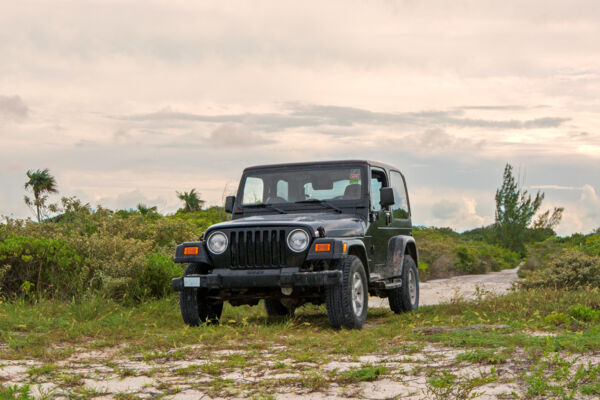 Jeep Wrangler rental vehicle parked on the coast of North Caicos