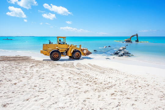 Front end loader on a beach