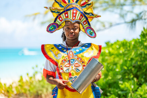 Turks and Caicos junkanoo player with a guiro instrument.