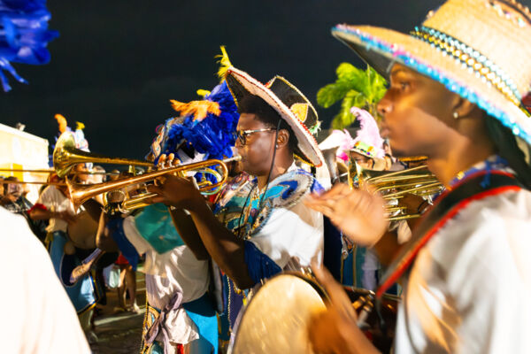 Junkanoo player playing trumpet at a fish fry in the Turks and Caicos Islands. 