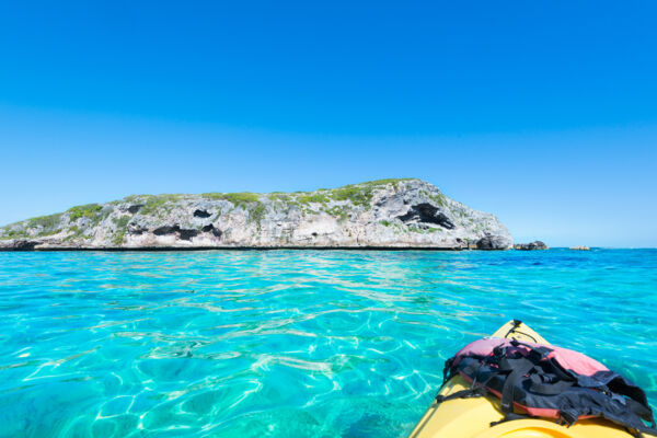 Kayaking near a small flank margin cave on a rock near Middle Caicos