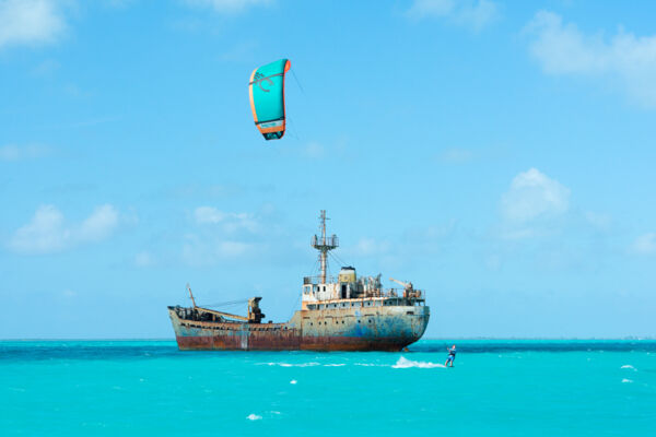 La Famille Express shipwreck and kiteboarder at Long Bay in the Turks and Caicos