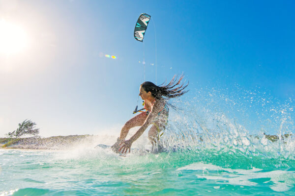 Kiteboarder at Long Bay Beach at sunset