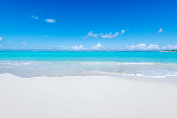 White sand and breaking waves on the beach at Leeward on Providenciales