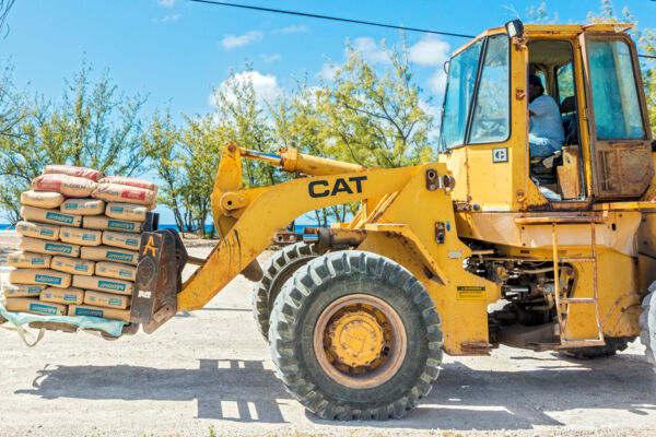 Front end loader with pallet of cement at Salt Cay