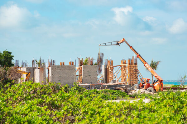 A luxury villa being built with concrete blocks