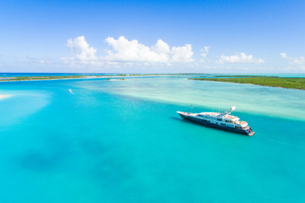 Luxury yacht cruising through Leeward Channel near Providenciales in the Turks and Caicos