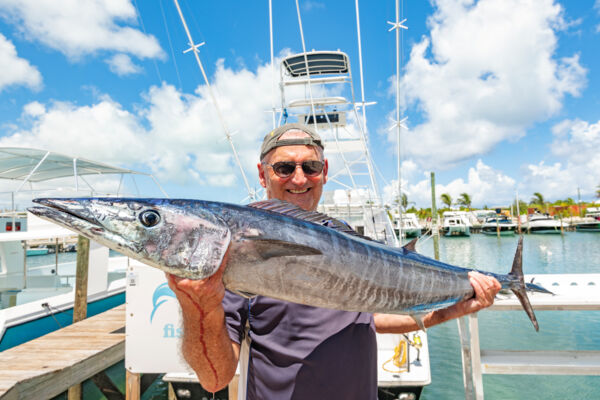 Man holding wahoo caught in Turks and Caicos. 