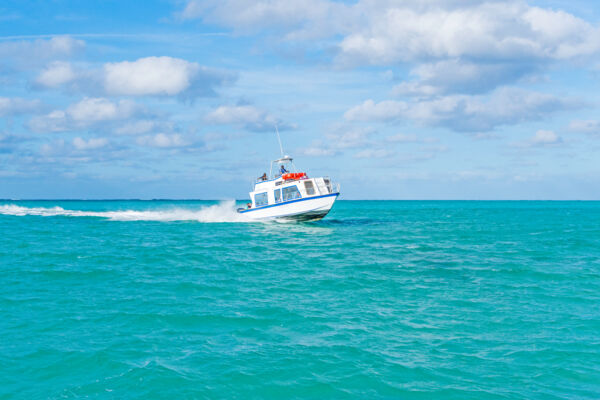 The Providenciales to North Caicos passenger ferry in the turquoise water of the Turks and Caicos