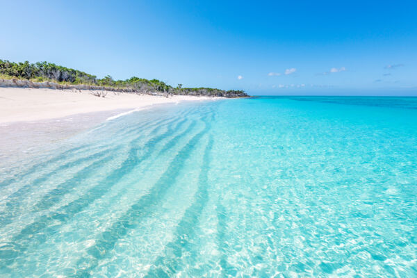 Clear ocean water and sand ridges at the beach on Little Water Cay