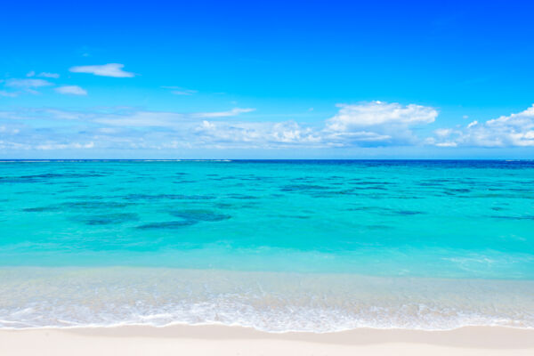 Turquoise water and reefs off the beach at the Northwest Point Marine National Park