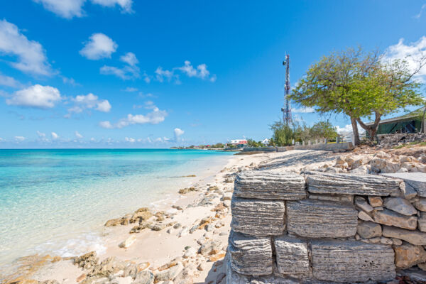 Old limestone block wall on the beach at Cockburn Town on Grand Turk