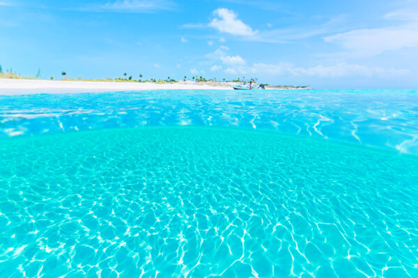 The crystal-clear ocean water at Half Moon Bay Beach in the Turks and Caicos