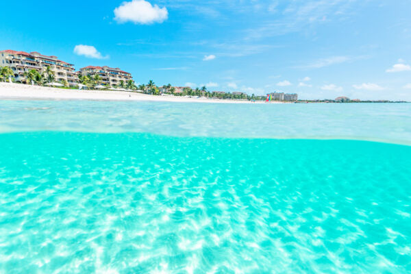 Clear ocean water and luxury resorts on Grace Bay Beach in the Turks and Caicos