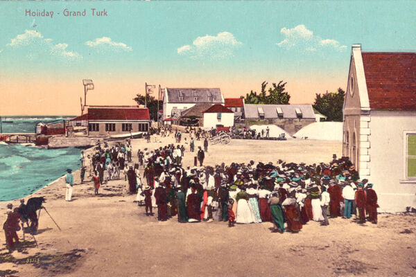 Vintage photograph of a holiday gathering on Front Street in Cockburn Town, Grand Turk