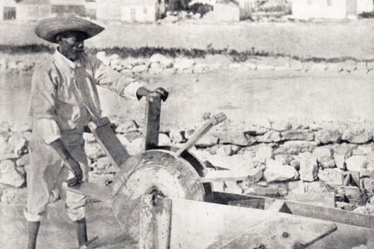 Historical photo of salt salina pump being turned by hand on Grand Turk