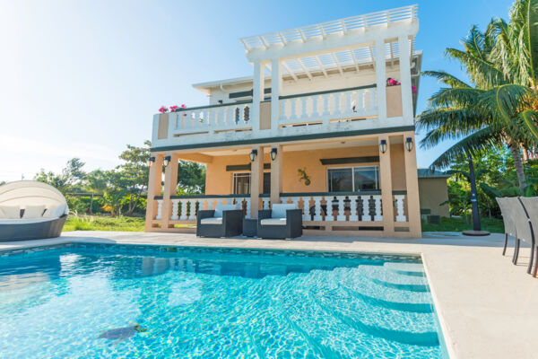 The swimming pool and exterior of Sea La Vie vacation villa at Long Bay on Providenciales