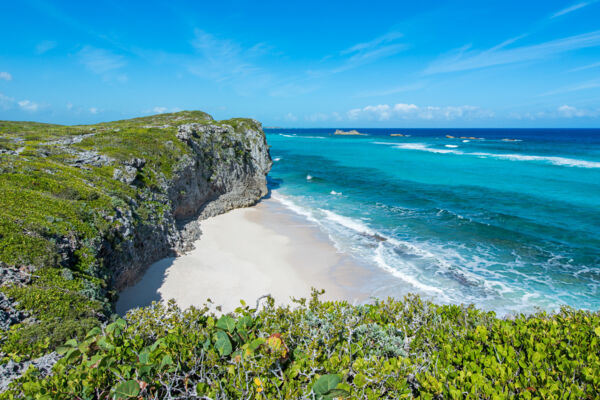 Small beach hidden in the cliffs at Mudjin Harbour in the Turks and Caicos