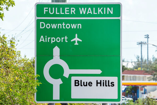 Sign on Leeward Highway for Downtown, the Providenciales Airport, and Blue Hills