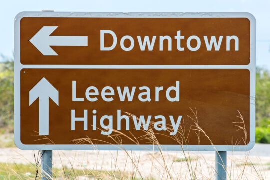Highway directional sign on Providenciales for Downtown and Leeward Highway