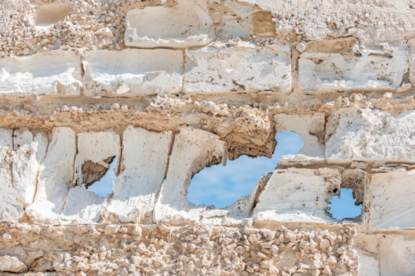 The eroded limestone walls of a salt warehouse in Cockburn Harbour in the Turks and Caicos