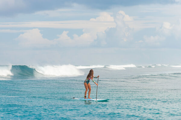 Stand-up paddle board surfing at West Reef in the Turks and Caicos