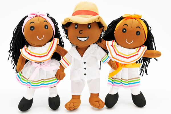 Turks and Caicos dolls wearing white cotton outfits on a white background.