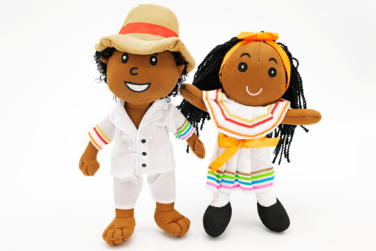 Turks and Caicos dolls wearing white cotton outfits on a white background.