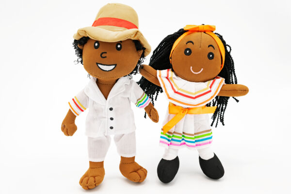 Turks and Caicos dolls wearing white cotton outfits on a white background.