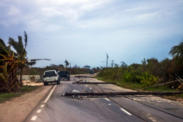 Fallen utility poles at Blue Hills on Providenciales after Hurricane Hanna