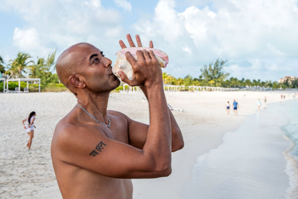 blowing a conch horn