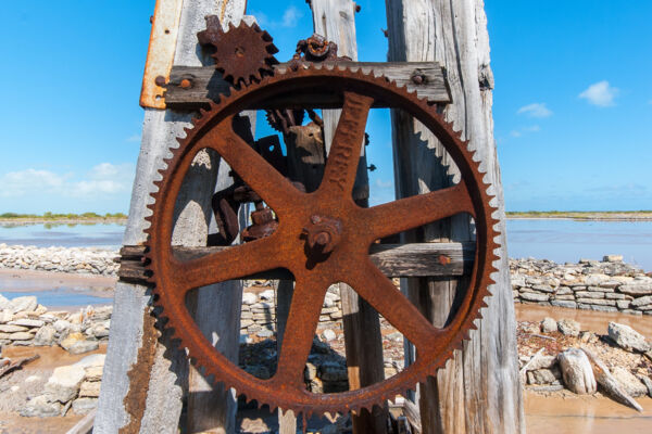 Metal gears on a windmill in the South Caicos salinas
