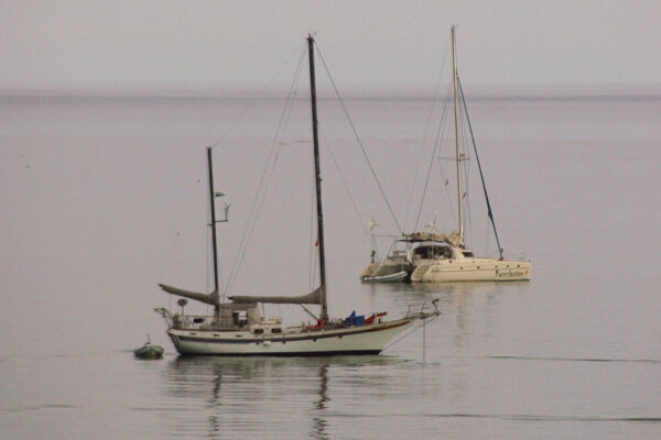 Two yachts moored in the waters of the Bight Beach on Providenciales