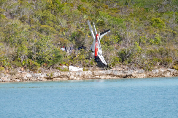 Police attending to a plane crash in Turks and Caicos. 