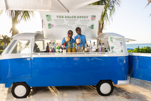Bartenders at a pop-up bar on Grace Bay Beach. 