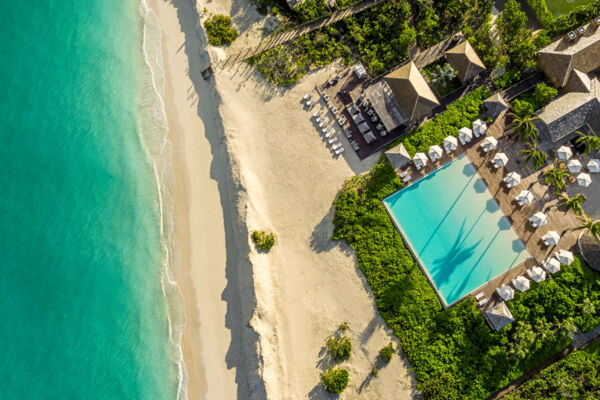 Aerial view of COMO Parrot Cay resort on the beach.