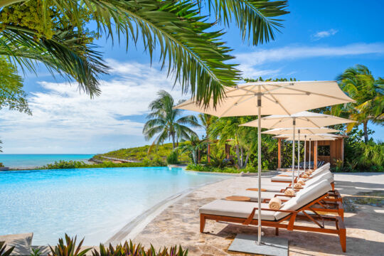 Infinity pool and loungers at Calico restaurant on Ambergris Cay
