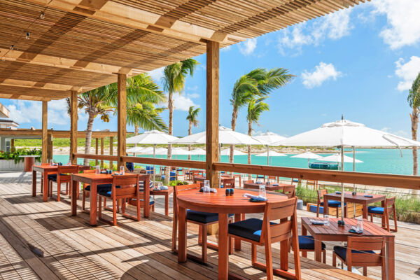 Outdoor dining space at a restaurant on Ambergris Cay