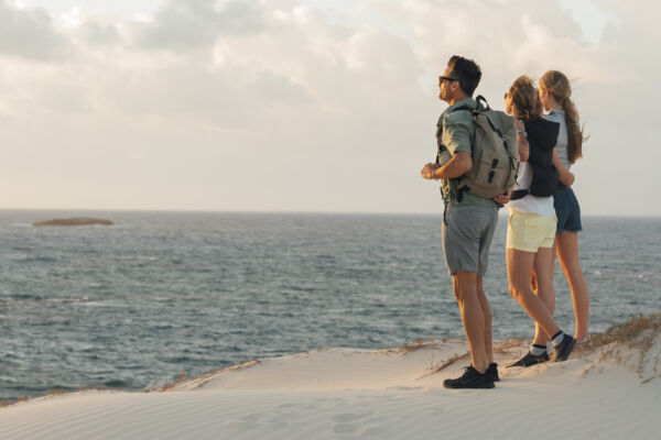 Hikers on a beach at Ambergris Cay