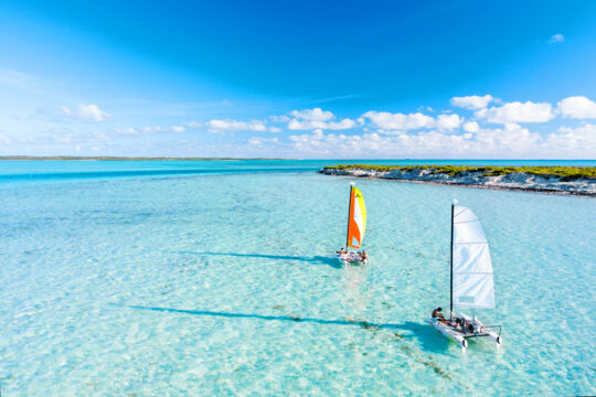 Hobie Cat sailboats sailing off Ambergris Cay